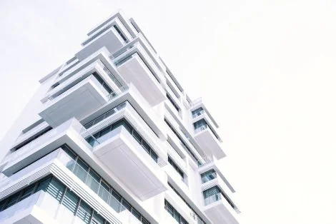 Modern sculptural architecture against a white sky